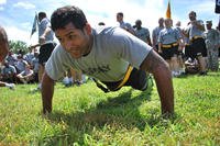 A soldier competes in a push-up contest.