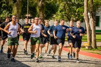 U.S. and Brazilian soldiers run.