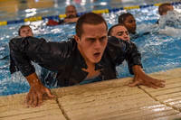Naval ROTC New Student Indoctrination midshipman candidates participate in swimming qualifications.