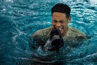 A community college student bobs to the surface of a pool during water confidence training at Joint Base Langley-Eustis.