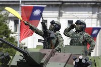 Taiwanese soldiers salute during National Day celebrations in Taipei.