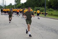 Naval ROTC midshipman candidates participate in a timed run as part of NROTC new student indoctrination.