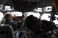 Pilots work in the cockpit of an AWACS plane at Melsbroek military airport in Melsbroek, Belgium
