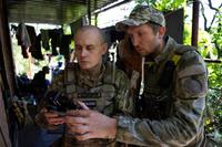 Ukrainian servicemen correct artillery fire by drone at the frontline near Kharkiv, Ukraine.