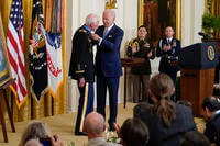 President Joe Biden awards the Medal of Honor to retired Maj. John Duffy