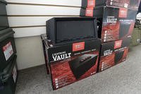 Guns safes sit against a wall at a gun shop in Lynnwood, Washington.
