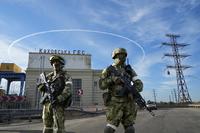 Russian troops guard Kakhovka Hydroelectric Station in south Ukraine.