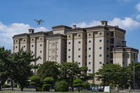 An 8th Civil Engineer Squadron Small Unmanned Aircraft System prepares to land after surveying the rooftop of a dorm building at Kunsan Air Base, Republic of Korea.