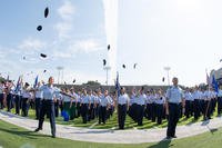 The Air Force’s newest commissioned officers, part of Officer Training School class 19-07, throw their flight caps in the air following their graduation ceremony Sept. 27, 2019, in Montgomery, Alabama.