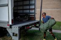 U.S. Army soldier loads a moving truck  at Fort Bragg.