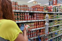 Casey Cooper, grocery manager for the Arnold Air Force Base Commissary, scans an item while fulfilling an order in the Commissary CLICK2GO system, at Arnold Air Force Base, Tenn.