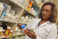 Pharmacist at Naval Branch Health Clinic Kings Bay reviews a prescription.