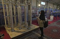 Student looks at Iran's domestically built centrifuges.