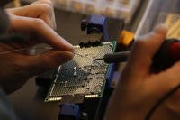 A U.S. Army soldier works on equipment during the second Marne Innovation Workshop at the Georgia Institute of Technology in Atlanta.