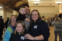 Sgt. 1st Class John Sochocki of 4th Brigade, 1st Armored Division, is encircled by his wife, Dorothy, and children after returning from his fifth deployment to Iraq at Fort Bliss, Texas.