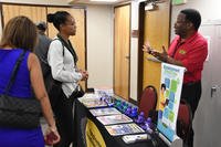 Attendees discuss employment and the job search process with a certified career counselor with the Army Community Service Employment Readiness Program.