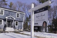 A &quot;For Sale&quot; sign is posted outside a single-family home in Derry, N.H.