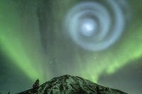 northern light enthusiasts got a surprise when something odd was mixed in with the green bands of light