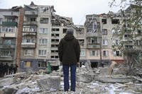 A resident looks at his home, damaged by a Russian rocket attack in Sloviansk, Ukraine.