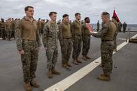 U.S. Marines promoted to the rank of Corporal aboard the USS Fort McHenry.