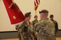 Lt. Col. Meghann Sullivan takes the guidon.