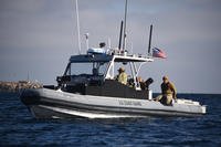U.S. Coast Guard Port Security Unit (PSU) 311 members and U.S. Navy Maritime Expeditionary Security Squadron 11 members complete joint agency exercises aboard a 32-foot transportable port security boat off San Clemente Island.