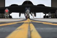 Crew chiefs assigned prepare the B-2 Spirit stealth bomber for take off.