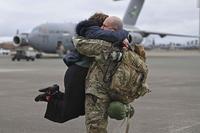 Airman is welcomed home from a deployment by a loved one