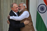 Indian Prime Minister Narendra Modi hugs Russian President Vladimir Putin.