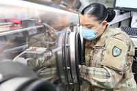 Army specialist performs COVID-19 testing at the mobile lab.