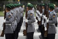 Soldiers of the honor guard prepare for a military welcome ceremony as part of a meeting of German Defence Minister Ursula von der Leyen