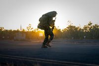 Marine rushes across a runway during an airfield seizure exercise at Mount Bundey Training Area, NT, Australia