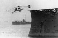 Eugene Ely flies his Curtiss pusher biplane from the USS Birmingham in Hampton Roads, Virginia, on Nov. 14, 1910, the first time an airplane took off from a U.S. warship.