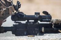 A U.S. Marine uses a squad common optic to conduct a live-fire drill during the Adversary Force Exercise at Marine Corps Air Ground Combat Center, Twentynine Palms, California, April 17, 2022. (U.S. Marine Corps photo by Lance Cpl. Megan Ozaki) A U.S. Marine uses a squad common optic to conduct a live-fire drill