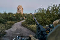 A Ukrainian soldier sits in his position in Avdiivka, Ukraine.