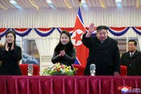 North Korean leader Kim Jong Un, second right, with his daughter and his wife Ri Sol Ju, left