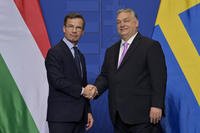 Sweden's Prime Minister Ulf Kristersson shakes hands with his Hungarian counterpart Viktor Orban