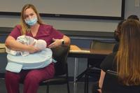 A registered nurse and international board certified lactation consultant at Naval Hospital Jacksonville’s Maternal Infant Unit, teaches a prenatal breastfeeding class to expecting moms and their support persons. (U.S. Navy photo by Deidre Smith, Naval Hospital Jacksonville) A registered nurse and international board certified lactation consultant