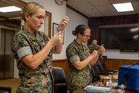 Navy Corpsmen prepare Influenza vaccines and COVID-19 booster shots on Marine Corps Base Camp Lejeune