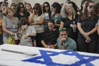 Mourners attend a funeral in Ashkelon, Israel.