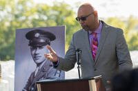 Steve Woodson speaks at a ceremony for his father, Cpl. Waverly B. Woodson Jr.,