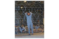 Blindfolded Palestinians in a detention center