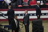 Secret Service officers look on as former President Donald Trump speaks at a campaign event
