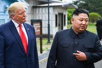 North Korea's leader Kim Jong Un speaks as he stands with U.S. President Donald Trump
