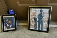 Candles and framed photos of Roger Fortson, a U.S. Air Force senior airman