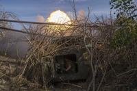 Ukrainian servicemen fire self-propelled artillery towards Russian positions