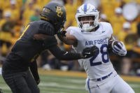 Air Force running back Aiden Calvert stiff-arms Baylor linebacker Keaton Thomas