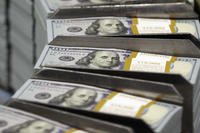 stacks of $100 bills