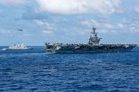 The Nimitz-class aircraft carrier USS Theodore Roosevelt (CVN 71) sails