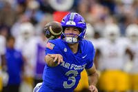 Air Force quarterback John Busha pitches the football